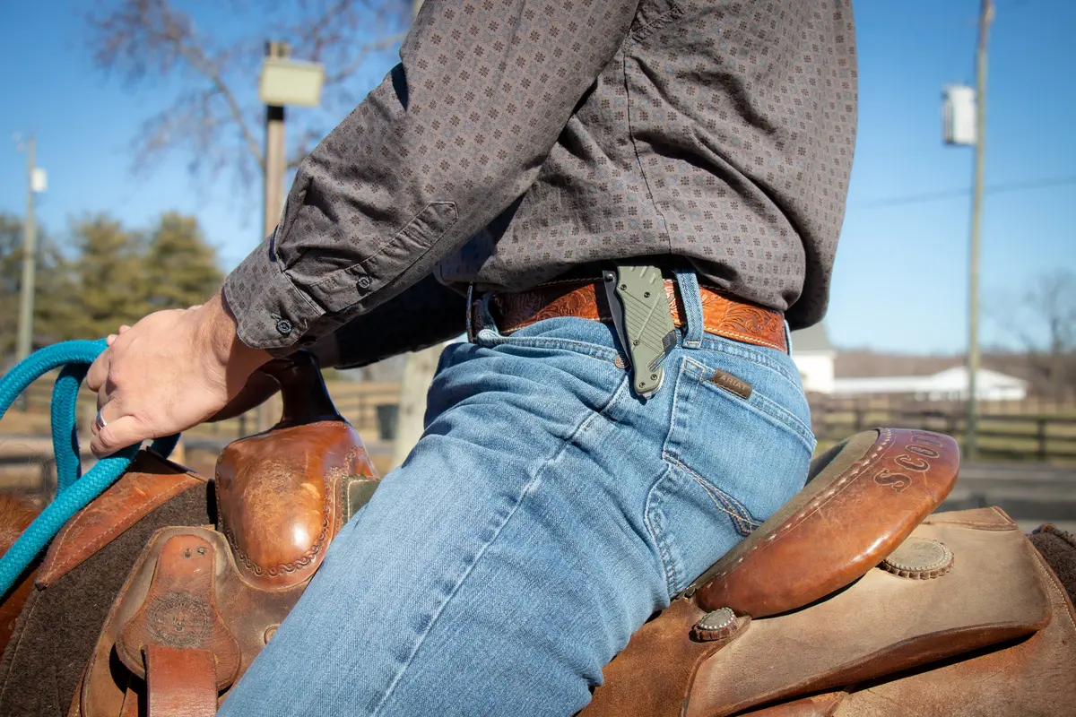 Close view of a rider’s pelvis and midsection aligned in the saddle
